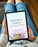 Person holding a tablet with a postpartum journal app on a couch